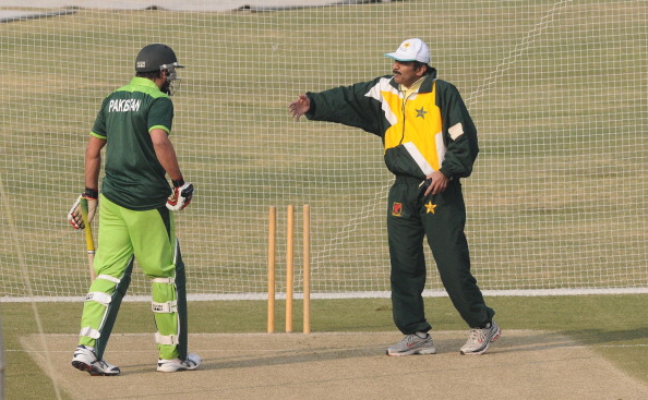 Pakistani team batting consultant Javed Miandad (R) gives tips to cricketer Shahid Afridi during a training session in Lahore on December 8, 2010.  Pakistan hit top gear in preparing for next year's World Cup with former great Javed Miandad giving special coaching to faltering batsmen in a week-long training camp. Pakistan tour New Zealand for three Twenty20 matches, two Tests and six one-day internationals before The World Cup which is to be jointly hosted by Bangladesh, India and Sri Lanka February 19-April 2, 2011.  AFP PHOTO/Arif ALI (Photo credit should read Arif Ali/AFP/Getty Images)